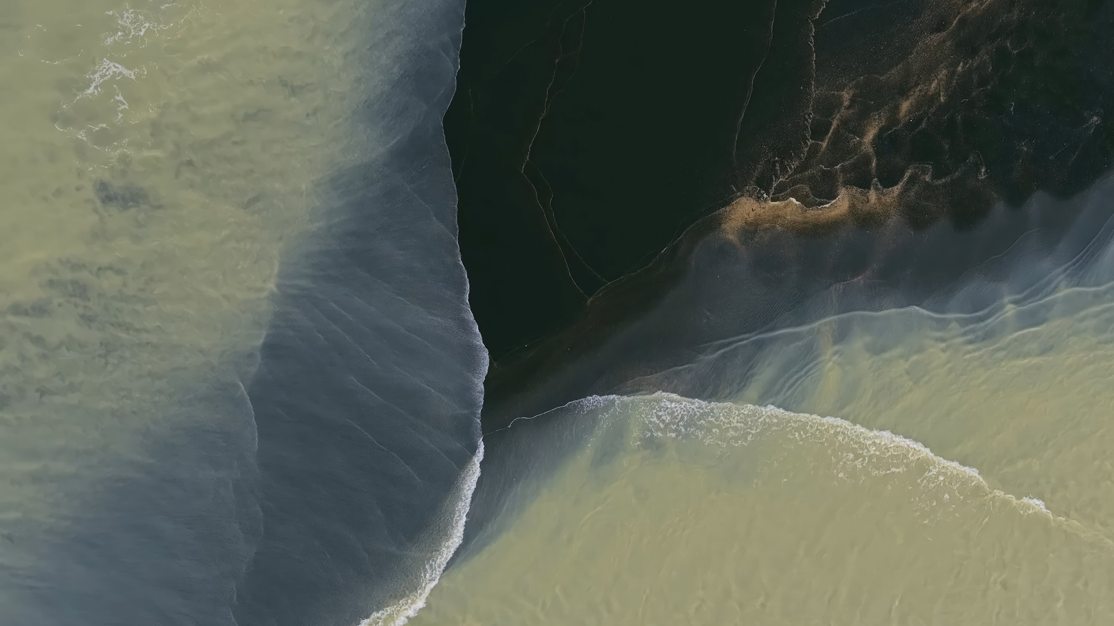 Where Massive Rivers Meet The Black Sand Shore