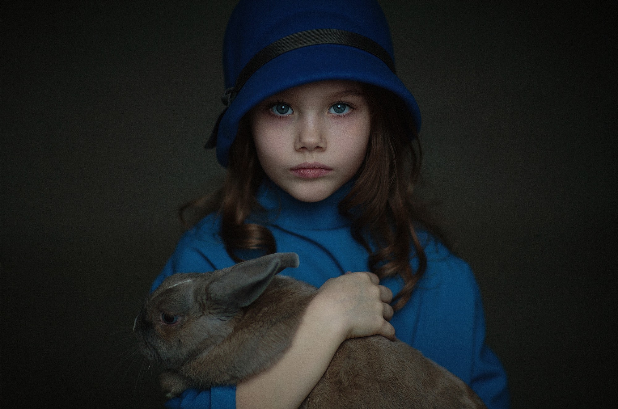Toddler Girl Holding Fluffy White Rabbit